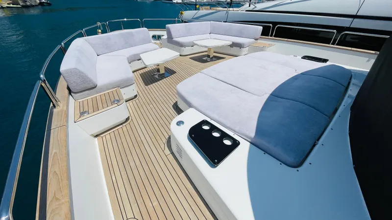  Yacht Photos Pics Luxurious 2024 Sirena 78 yacht deck with plush seating and sunbathing area.