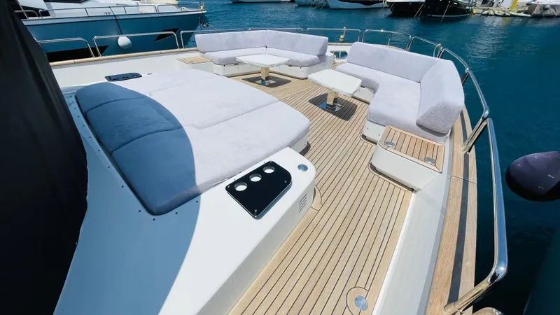  Yacht Photos Pics Luxurious 2024 Sirena 78 yacht deck with plush seating and elegant wood finish.