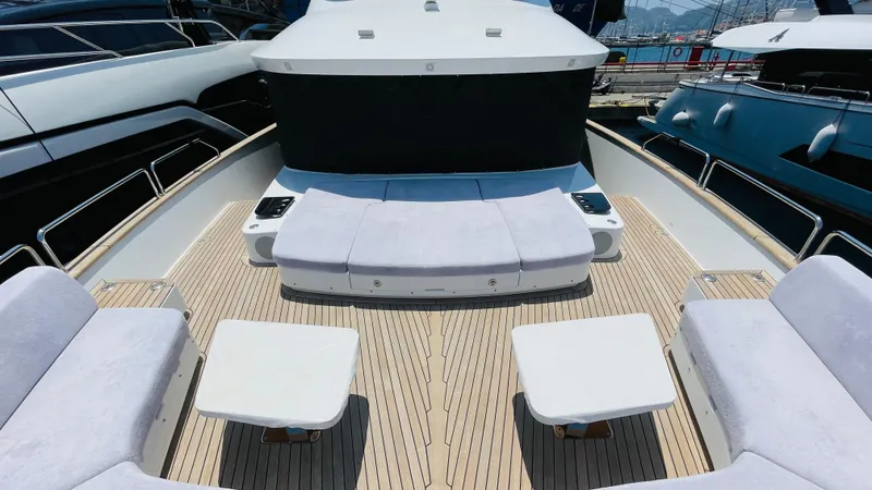  Yacht Photos Pics Luxurious 2024 Sirena 78 yacht deck with plush seating and sleek design.