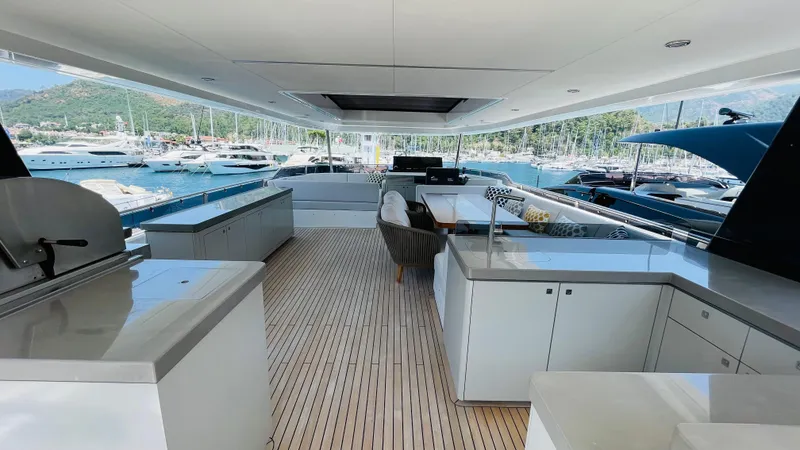  Yacht Photos Pics Luxurious 2024 Sirena 78 yacht interior with modern design and marina view.