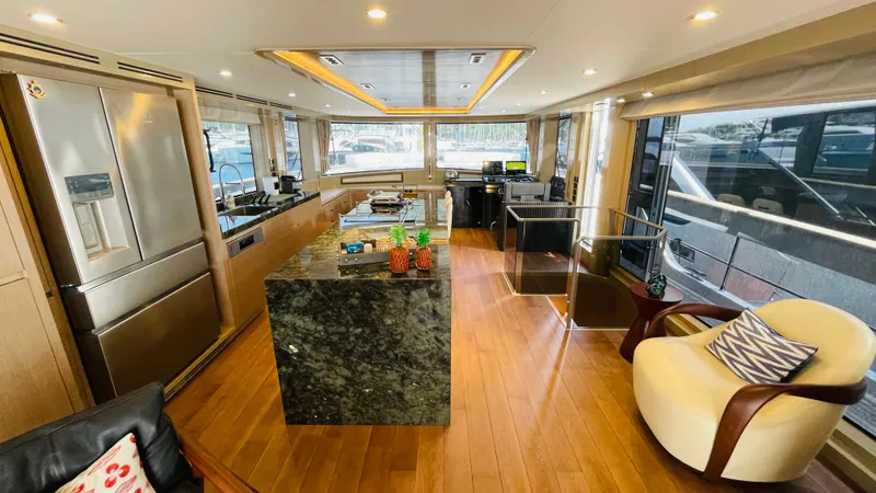 Yacht Photos Pics Luxurious interior of 2024 Sirena 78 yacht with modern kitchen and elegant seating area.