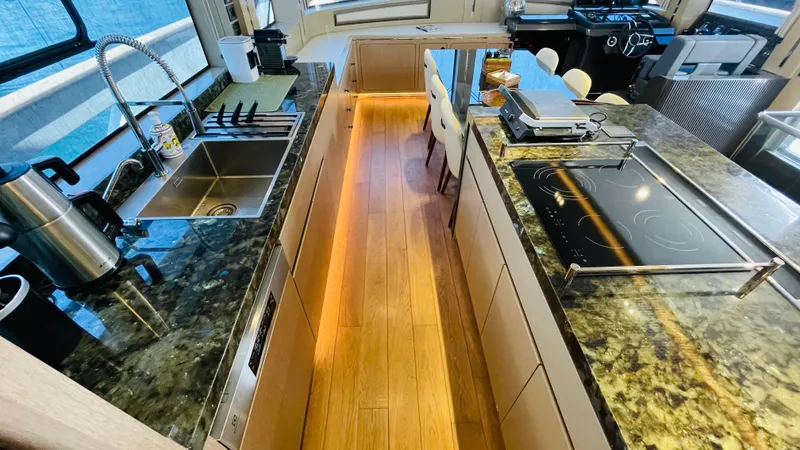  Yacht Photos Pics Luxurious kitchen interior of 2024 Sirena 78 yacht with modern appliances and sleek design.