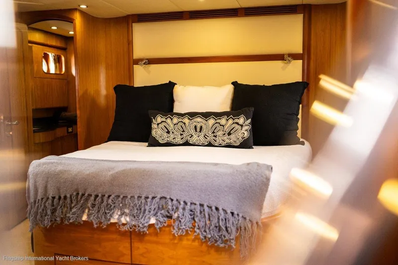 Pama 65 Pilot House Yacht Photos Pics Luxurious bedroom interior of 2011 Pama 65 Pilot House yacht with elegant bedding.