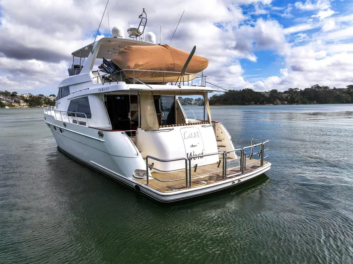 Pama 65 Pilot House Yacht Photos Pics Luxury 2011 Pama 65 Pilot House yacht on calm water under a partly cloudy sky.