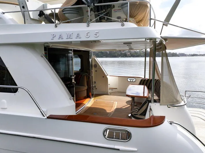 Pama 65 Pilot House Yacht Photos Pics Luxury 2011 Pama 65 Pilot House yacht with elegant outdoor seating and scenic water view.