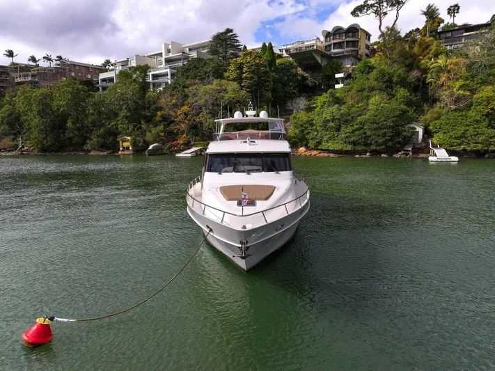 Pama 65 Pilot House Yacht Photos Pics Front view of a 2011 Pama 65 Pilot House yacht anchored in a scenic bay.