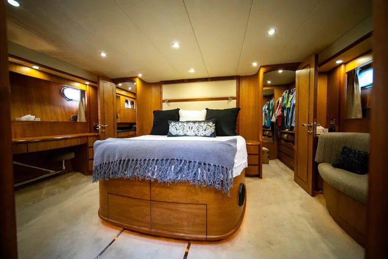Pama 65 Pilot House Yacht Photos Pics Luxurious bedroom interior of 2011 Pama 65 Pilot House yacht with elegant wood finish.