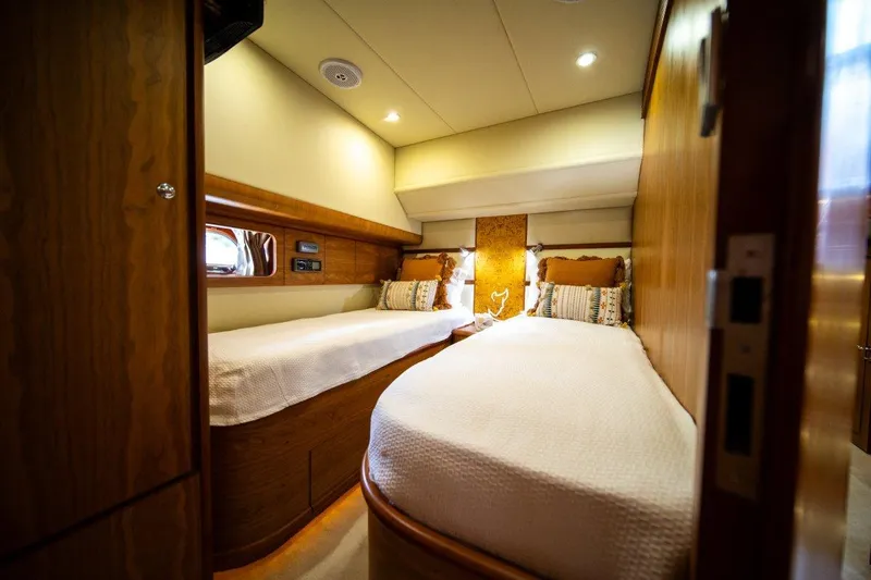 Pama 65 Pilot House Yacht Photos Pics Interior of 2011 Pama 65 Pilot House yacht with twin beds and wooden finish.