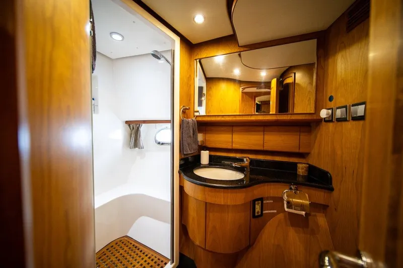 Pama 65 Pilot House Yacht Photos Pics Luxurious bathroom in 2011 Pama 65 Pilot House yacht with wood accents and modern fixtures.