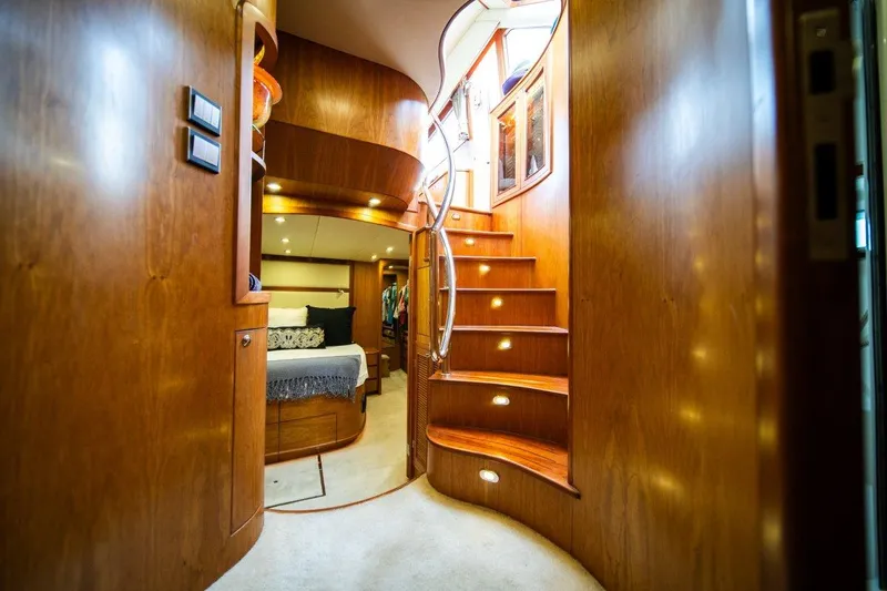 Pama 65 Pilot House Yacht Photos Pics Luxurious interior of 2011 Pama 65 Pilot House yacht with elegant wooden staircase.
