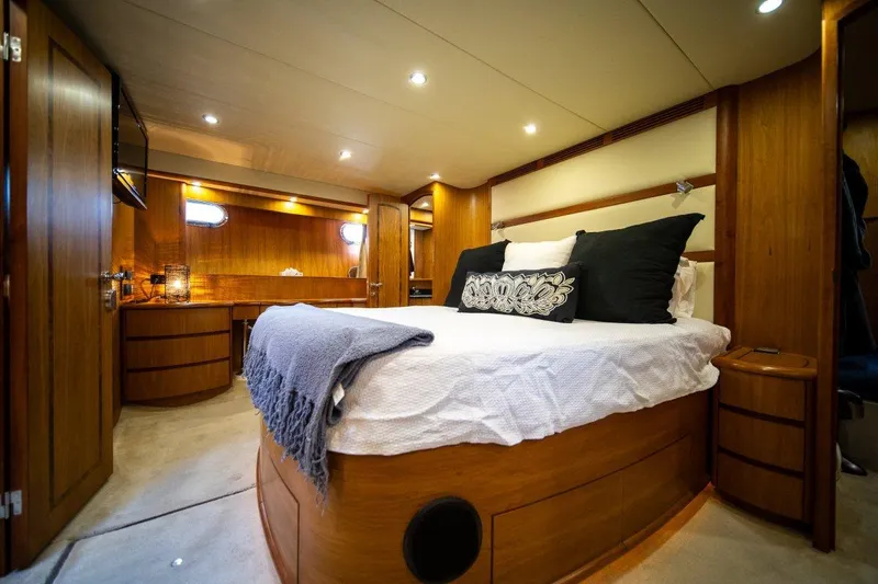 Pama 65 Pilot House Yacht Photos Pics Luxurious bedroom interior of 2011 Pama 65 Pilot House yacht with elegant wood finish.