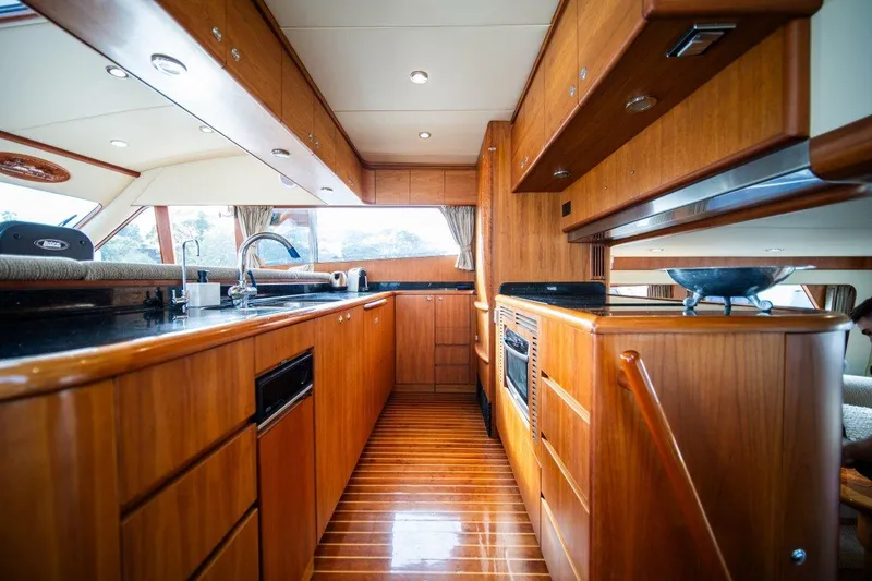 Pama 65 Pilot House Yacht Photos Pics Luxurious wooden kitchen interior of 2011 Pama 65 Pilot House yacht.
