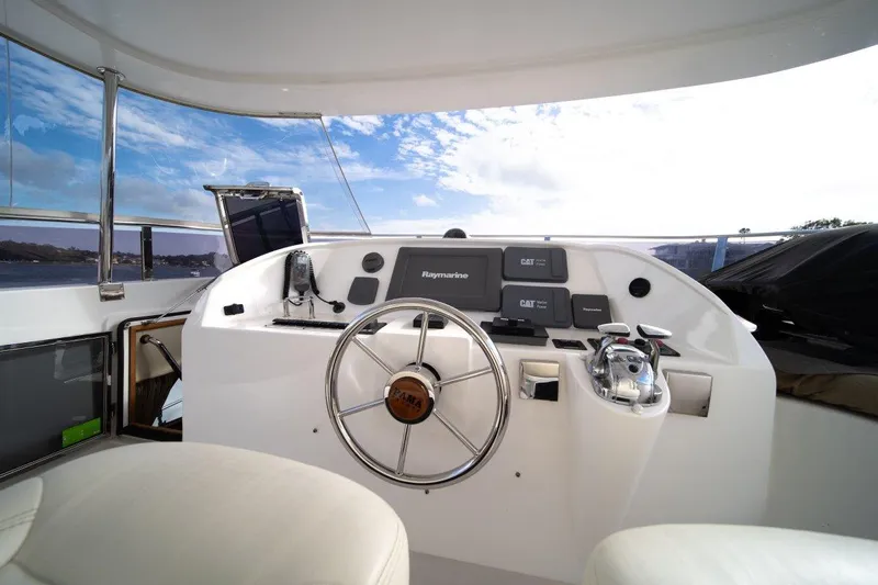 Pama 65 Pilot House Yacht Photos Pics Pilot house of 2011 Pama 65 yacht with steering wheel and navigation equipment.