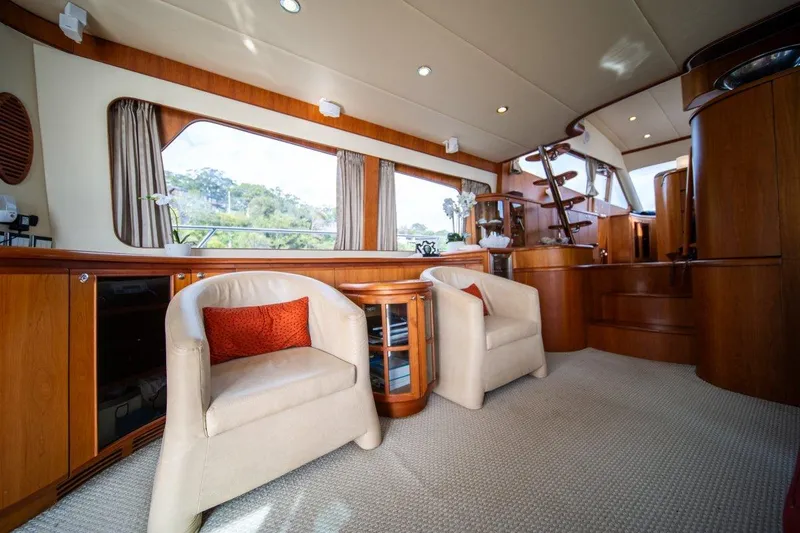 Pama 65 Pilot House Yacht Photos Pics Luxurious interior of 2011 Pama 65 Pilot House yacht with elegant seating and wood finishes.