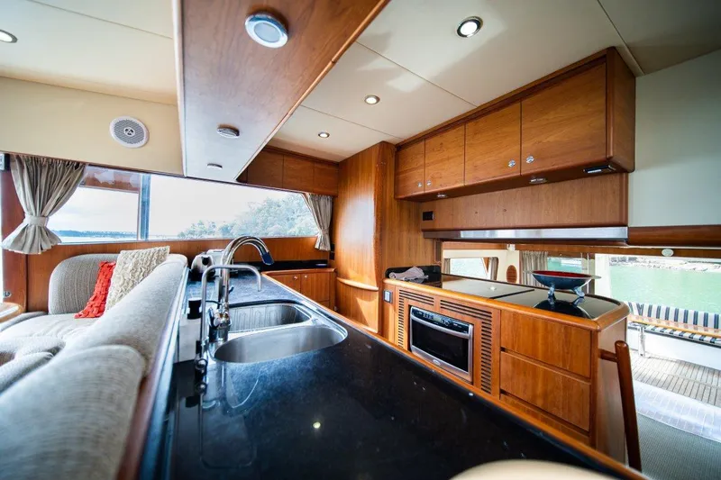 Pama 65 Pilot House Yacht Photos Pics Luxurious interior of 2011 Pama 65 Pilot House yacht with modern kitchen amenities.