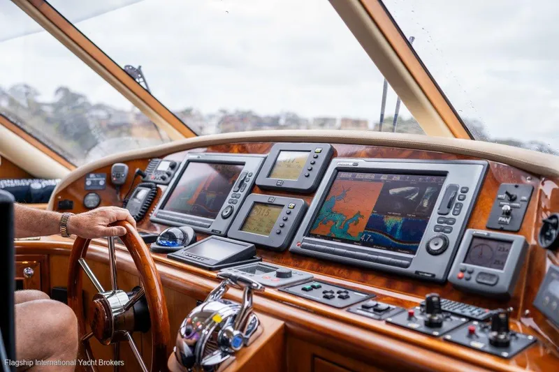 Pama 65 Pilot House Yacht Photos Pics Pilot house of 2011 Pama 65 yacht with navigation equipment and steering wheel.