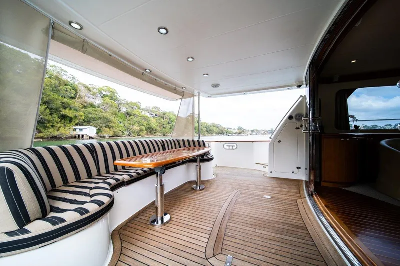 Pama 65 Pilot House Yacht Photos Pics Luxurious 2011 Pama 65 Pilot House yacht with elegant seating and wooden deck.