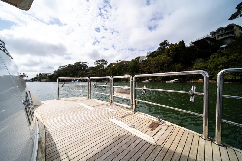 Pama 65 Pilot House Yacht Photos Pics Deck view of 2011 Pama 65 Pilot House yacht on a scenic waterway.