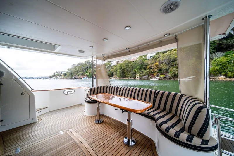 Pama 65 Pilot House Yacht Photos Pics Luxurious 2011 Pama 65 Pilot House yacht with elegant outdoor seating and scenic water view.