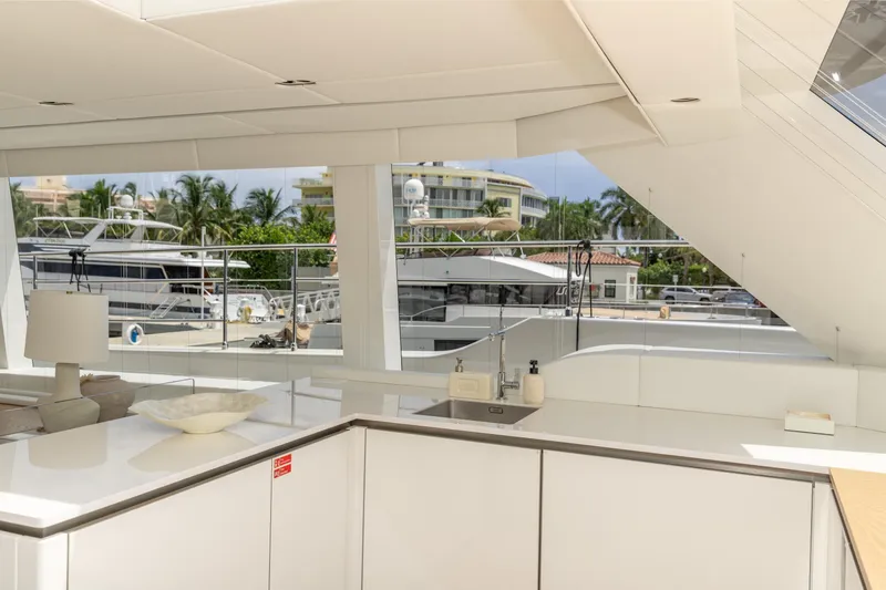 Fat Cat Yacht Photos Pics Luxurious Sunreef 80 Power Cat 2024 yacht interior with modern kitchen and marina view.