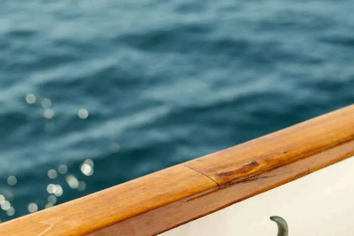 Deramore Yacht Photos Pics 1971 Dagless Ambassador boat railing with ocean background.