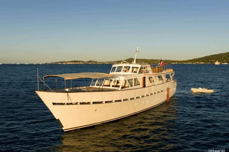 Deramore Yacht Photos Pics 1971 Dagless Ambassador yacht on calm sea under clear sky.