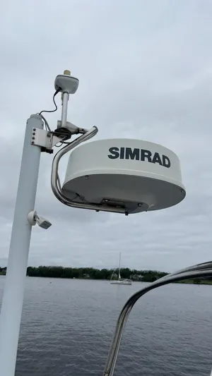 Wasabi Pea Yacht Photos Pics Simrad radar on 2003 J Boats J/46 sailboat, overcast sky, calm water.