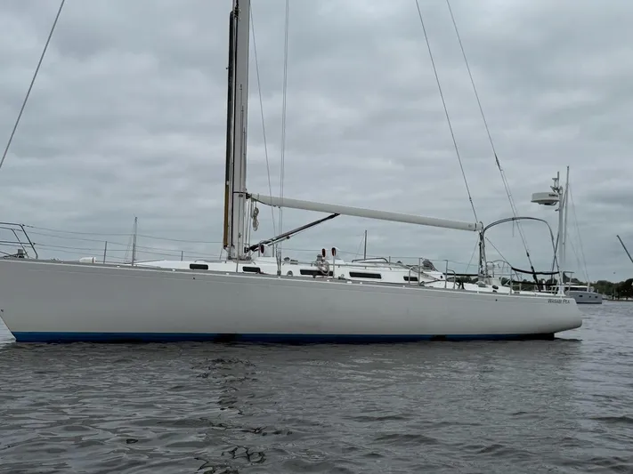 Wasabi Pea Yacht Photos Pics 2003 J Boats J/46 sailboat on calm water under cloudy skies.