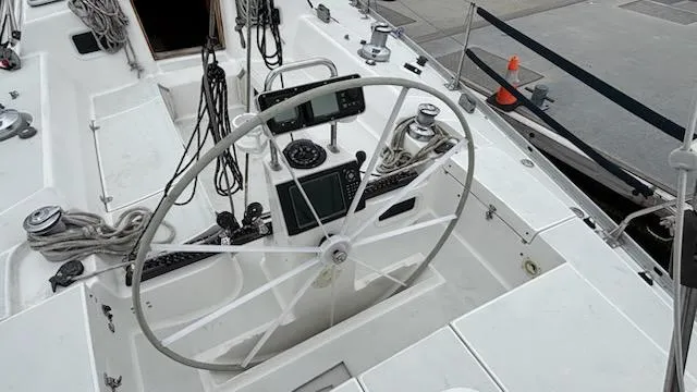 Wasabi Pea Yacht Photos Pics Cockpit of 2003 J Boats J/46 sailboat with steering wheel and navigation instruments.