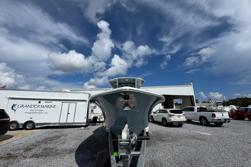 Yacht Photos Pics 2023 Sea Hunt Gamefish 30 Coffin Box boat at Grander Marine dealership under a blue sky.