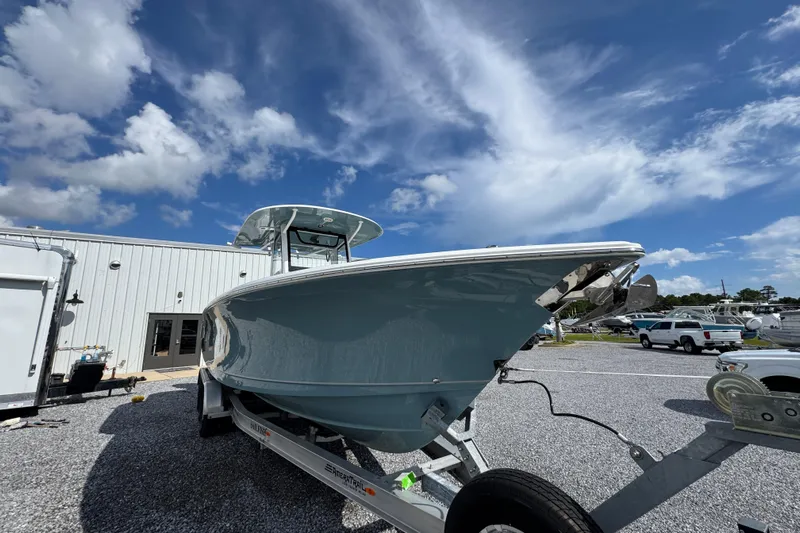  Yacht Photos Pics 2023 Sea Hunt Gamefish 30 Coffin Box boat on trailer under blue sky.