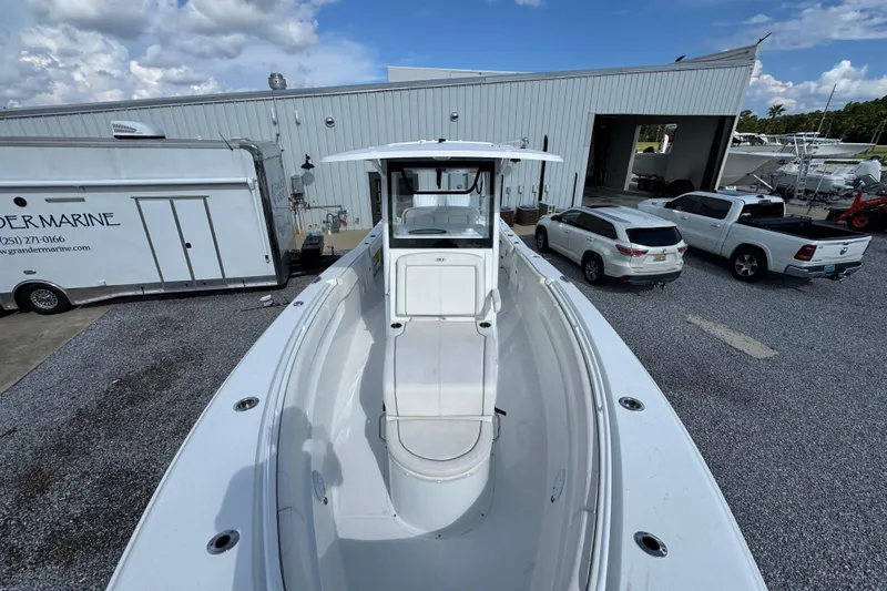  Yacht Photos Pics 2023 Sea Hunt Gamefish 30 Coffin Box boat at a marina, surrounded by vehicles.