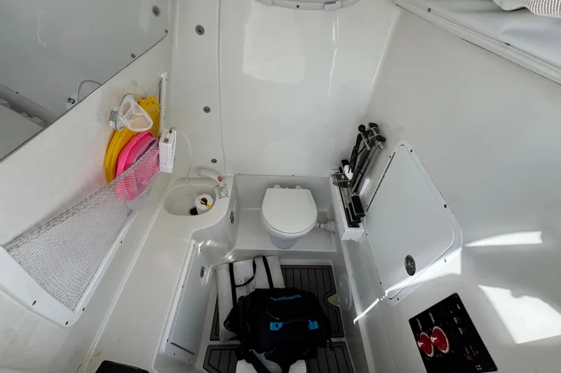 Yacht Photos Pics 2023 Sea Hunt Gamefish 30 Coffin Box interior with toilet and storage features.