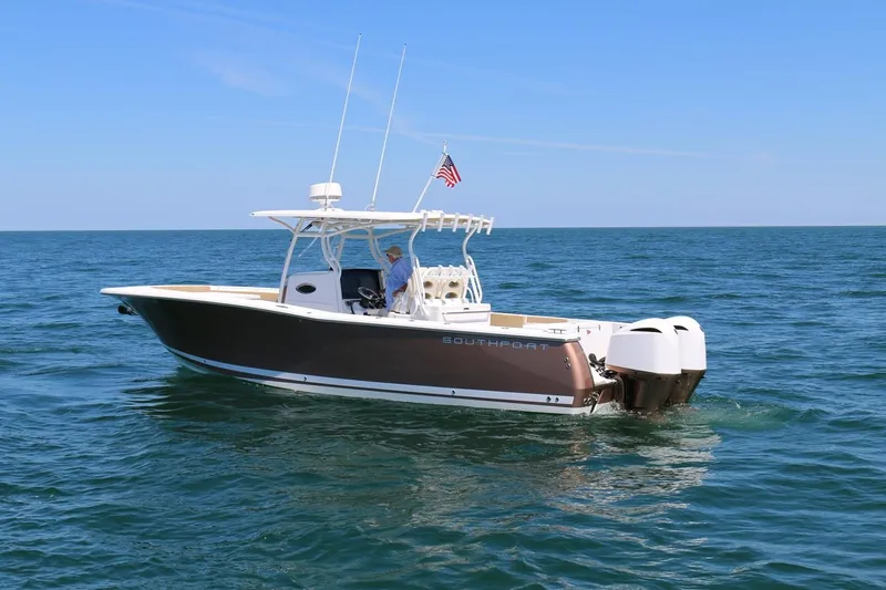  Yacht Photos Pics 2017 Southport 33 FE boat on open water with American flag.