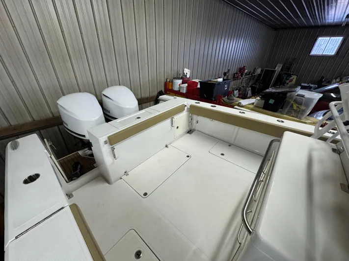 Yacht Photos Pics 2017 Southport 33 FE boat interior with dual engines in a storage facility.
