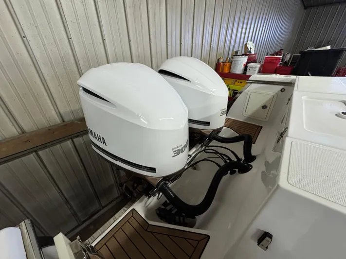  Yacht Photos Pics Twin Yamaha 300 outboard engines on a 2017 Southport 33 FE boat in a storage facility.
