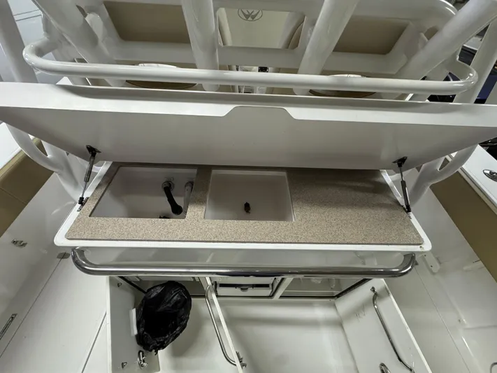  Yacht Photos Pics 2017 Southport 33 FE boat interior with sink and storage area.