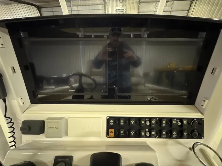  Yacht Photos Pics 2017 Southport 33 FE boat dashboard with control panel and steering wheel.