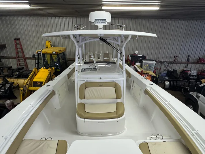  Yacht Photos Pics 2017 Southport 33 FE boat interior with beige seating in a garage setting.