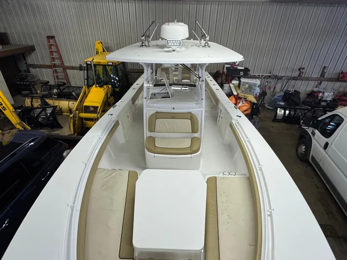  Yacht Photos Pics 2017 Southport 33 FE boat with spacious seating and modern design in a storage facility.