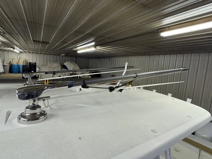  Yacht Photos Pics 2017 Southport 33 FE boat with fishing rod holders in a storage facility.