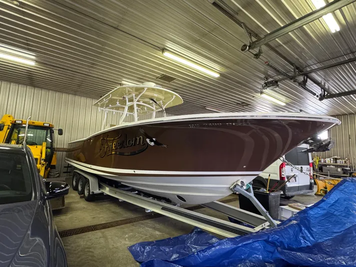  Yacht Photos Pics 2017 Southport 33 FE boat in a garage on a trailer.