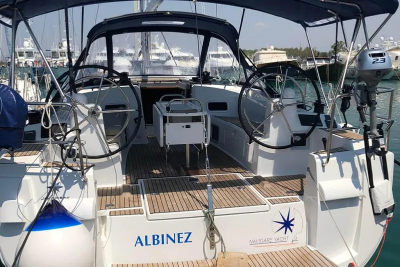 Albinez Yacht Photos Pics 2018 Jeanneau Sun Odyssey 479 sailboat with dual steering wheels in a marina.