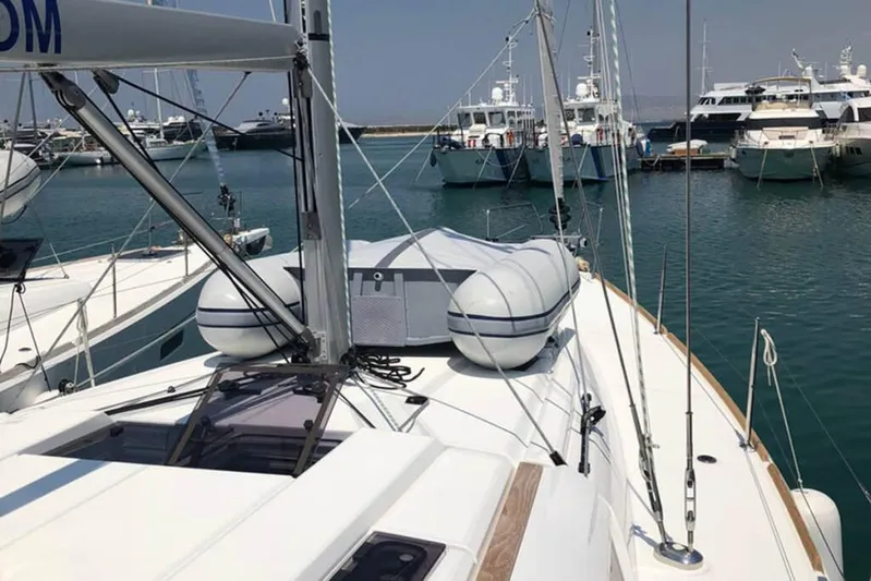 Albinez Yacht Photos Pics 2018 Jeanneau Sun Odyssey 479 sailboat docked in a marina with other yachts.