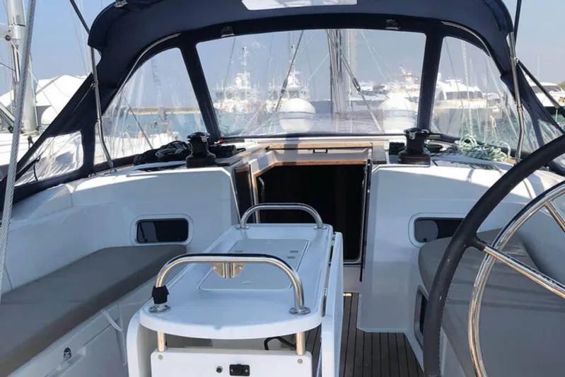 Albinez Yacht Photos Pics Cockpit of 2018 Jeanneau Sun Odyssey 479 sailboat with steering wheel and seating.