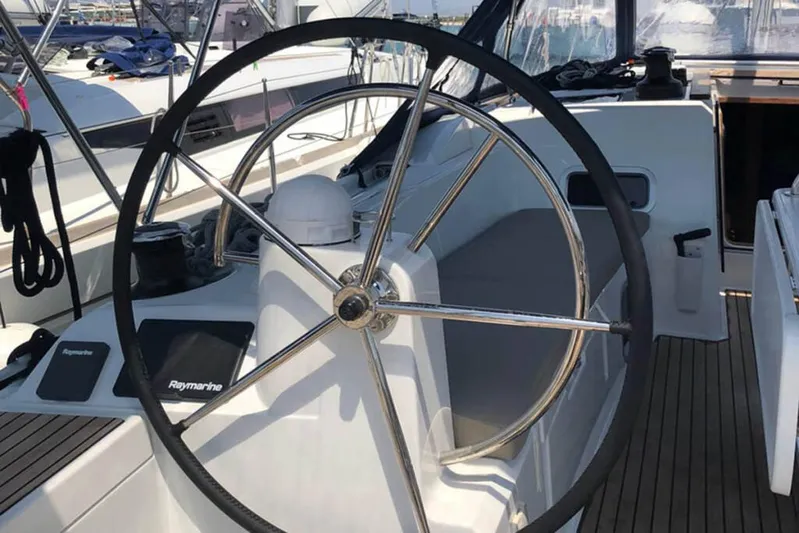 Albinez Yacht Photos Pics Steering wheel of 2018 Jeanneau Sun Odyssey 479 sailboat, featuring Raymarine navigation equipment.