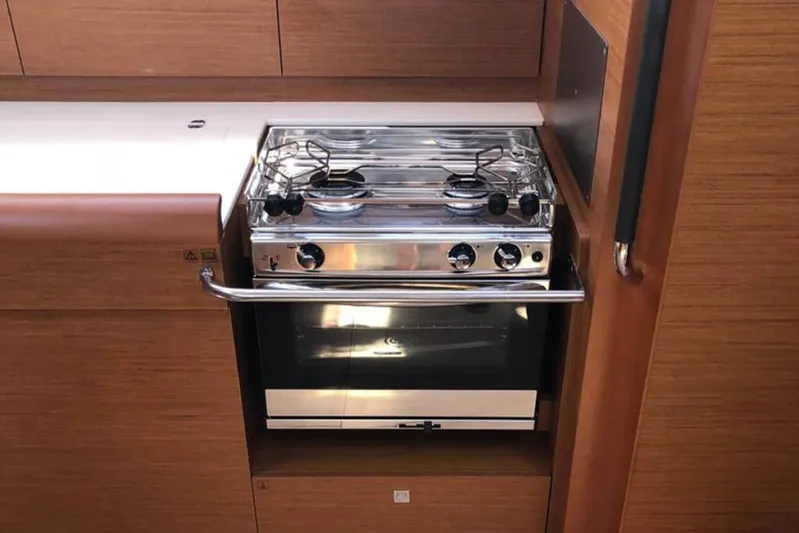 Albinez Yacht Photos Pics Galley kitchen in 2018 Jeanneau Sun Odyssey 479 with stove and oven.