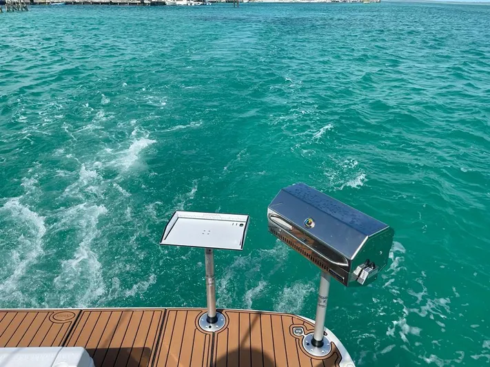Suenos Yacht Photos Pics 2005 Tiara Yachts 3600 Sovran on turquoise waters with a grill on deck.