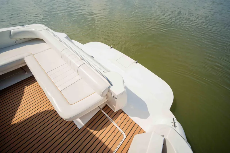  Yacht Photos Pics 1998 Sea Ray Sundancer 400 boat with teak deck and white seating, on calm water.