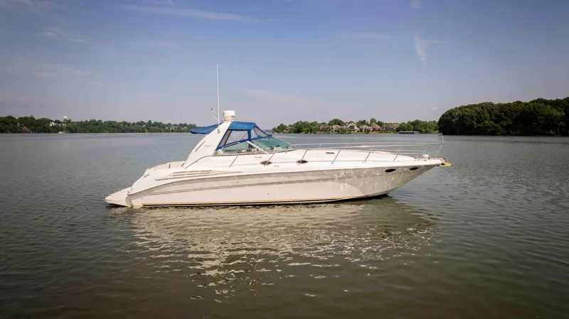  Yacht Photos Pics 1998 Sea Ray Sundancer 400 yacht on calm water under clear sky.